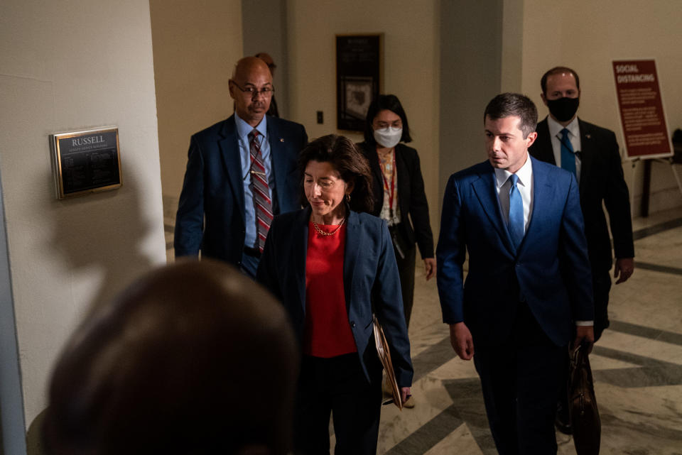 WASHINGTON, CA - MAY 18: Secretary of Commerce Gina Raimondo and Secretary of Transportation Pete Buttigieg leave the Russell Senate Office Building after meeting with Senate Republicans in an office of Sen. Shelley Moore Capito (R-WV) on Capitol Hill on May 18, 2021 in Washington, DC. (Kent Nishimura / Los Angeles Times via Getty Images)