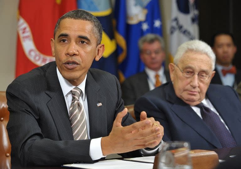 (FILES) US President Barack Obama speaks during a meeting on the new START Treaty as former Secretary of State Henry Kissinger (R) looks on November 18, 2010 in the Roosevelt Room of the White House in Washington, DC. Former US secretary of state Henry Kissinger, a key figure of American diplomacy in the post-World War II era, died November 29, 2023 at the age of 100, his association said. (Photo by Mandel NGAN / AFP)