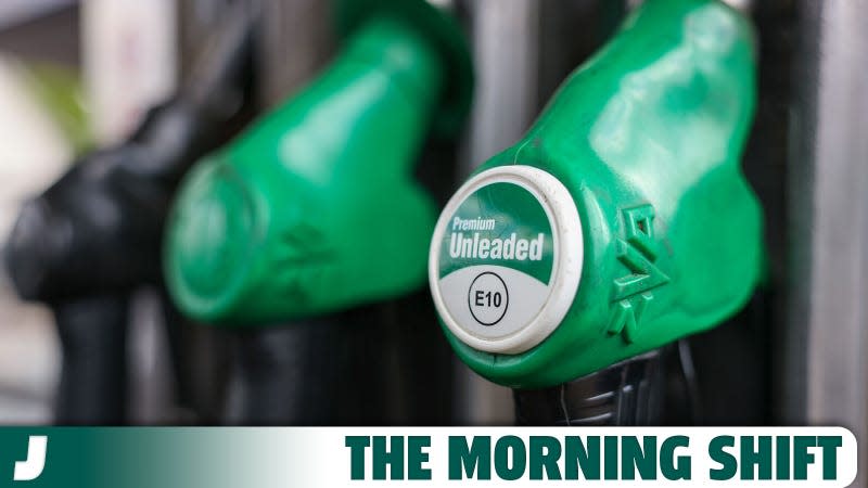 A photo of three gas pumps in the UK. 