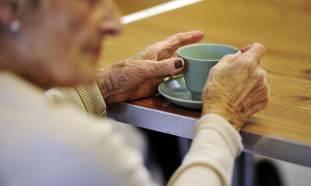 OLd woman drinking tea