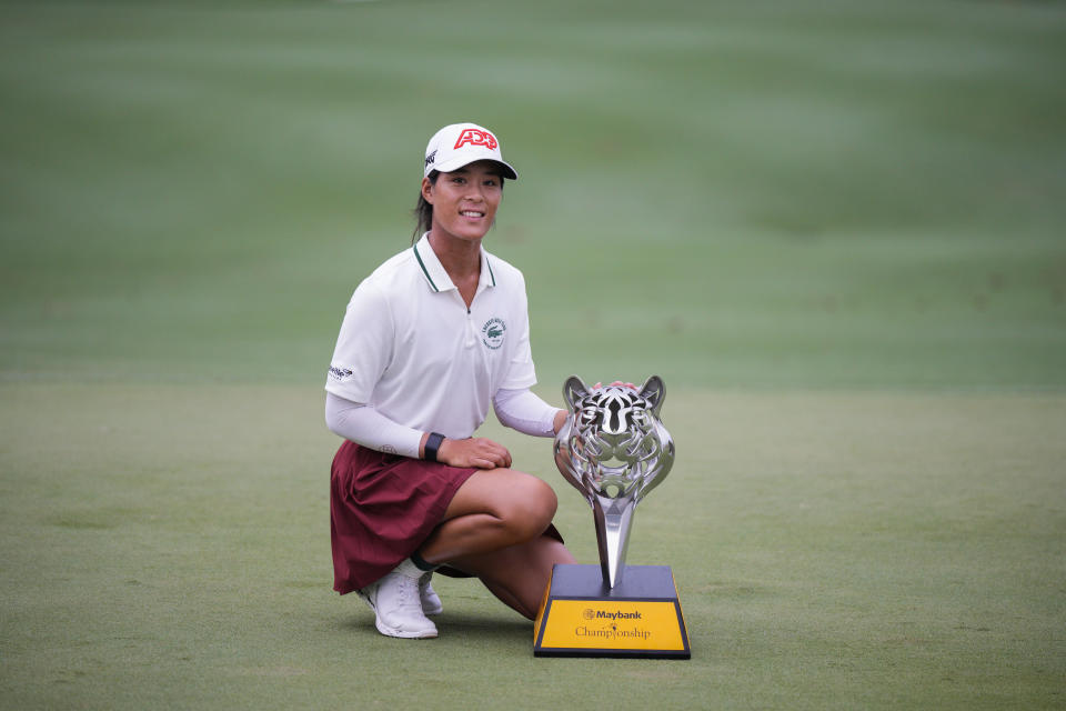 Celine Boutier of France poses with the winner's trophy after winning the final round of the LPGA Maybank Championship in Kuala Lumpur, Malaysia, Sunday, Oct. 29, 2023. (AP Photo/Vincent Thian)