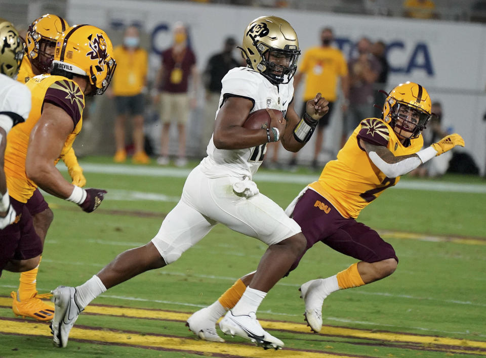 Colorado State quarterback Brendon Lewis (12) runs for a first down against Arizona State's defensive during the first half of an NCAA college football game Saturday, Sept 25, 2021, in Tempe, Ariz. (AP Photo/Darryl Webb)