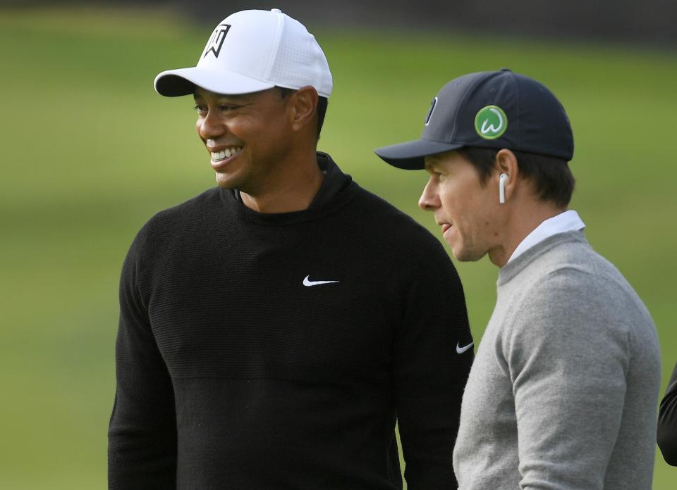 PACIFIC PALISADES, CA - FEBRUARY 14: Tiger Woods and actor/singer Mark Wahlberg watch play on the ninth hole during the Pro-Am round for the Genesis Open at Riviera Country Club on February 14, 2018 in Pacific Palisades, California. (Photo by Stan Badz/PGA TOUR)