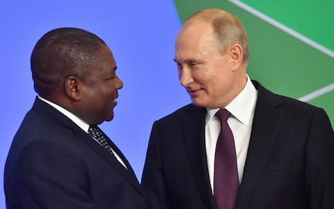 Vladimir Putin greets the president of Mozambique in Sochi last week - Credit: Kirill Kukhmar/TASS via Getty