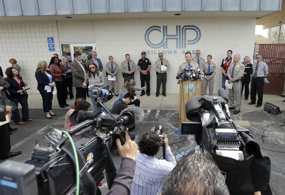 California Highway Patrol Multidisciplinary Accident Investigation Team Lt. Scott Fredrick, center right, speaks at a news conference in Willows, Calif., Friday, April 11, 2014. At least ten people were killed and dozens injured in the fiery crash between a FedEx truck and a bus carrying high school students on a visit to a Northern California College. (AP Photo/Jeff Chiu)