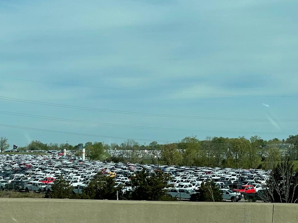Thousands of pickup trucks could be seen from Interstate 71 in Sparta, Ky., on Sunday. Ford Motor Co. had approximately 22,000 vehicles at the end of March primarily in North America awaiting installation of chip-related components, Chief Financial Officer John Lawler said during a first-quarter earnings call with analysts on April 28, 2021.