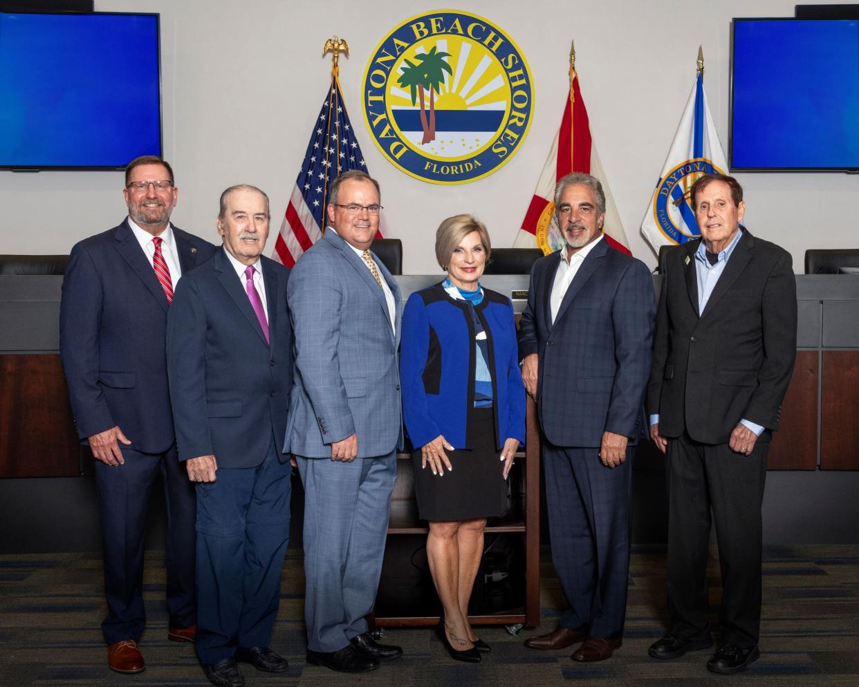 Daytona Beach Shores City Commissioners Mel Lindauer (second from left) and Richard Bryan (farthest right) have resigned, citing Florida's new law requiring elected city officials to complete a more detailed financial-disclosure form, which asks for information on net worth and assets.