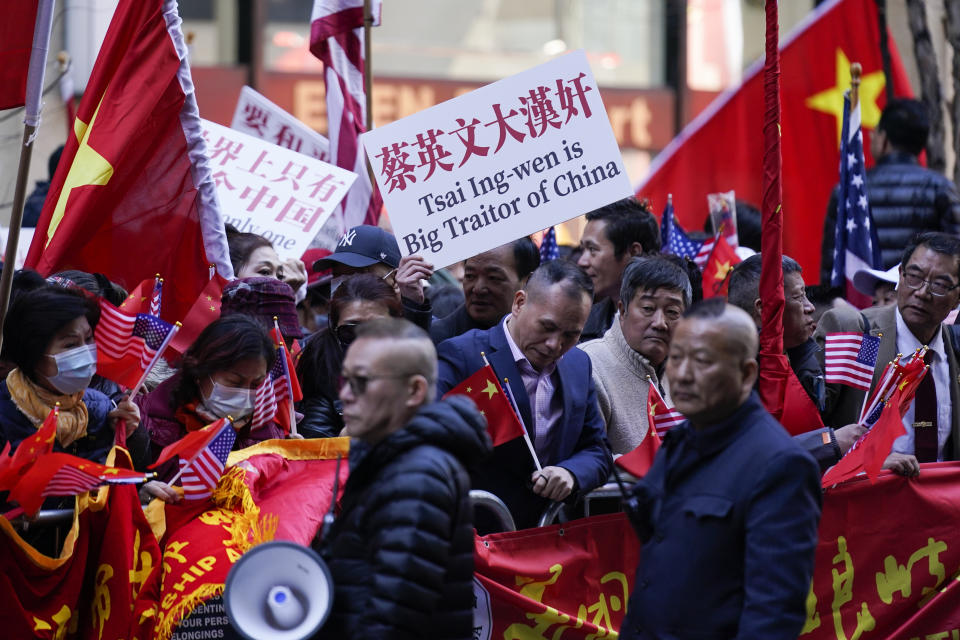 Protesters opposed to Taiwanese independence gather at a hotel where Taiwanese President Tsai Ing-wen is expected to arrive in New York, Wednesday, March 29, 2023. (AP Photo/Seth Wenig)