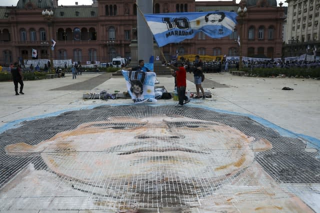 A mosaic of the face of Diego Maradona is painted on Plaza de Mayo, in front of the presidential palace in Buenos Aires