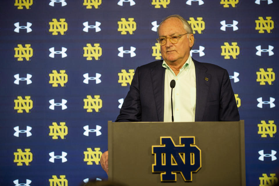 FILE - Notre Dame athletic director Jack Swarbrick answers questions regarding NCAA college football head coach Brian Kelly's resignation, Tuesday, Nov. 30, 2021, at Notre Dame Stadium in South Bend, Ind. Jack Swarbrick will step down as Notre Dame’s athletic director next year after a 16-year run in which he helped the school maintain its independent status amid an unprecedented flurry of conference realignment. Notre Dame announced Thursday, June 8, 2023, that NBC Sports chairman Pete Bevacqua will succeed Swarbrick. (Michael Caterina/South Bend Tribune via AP, File)