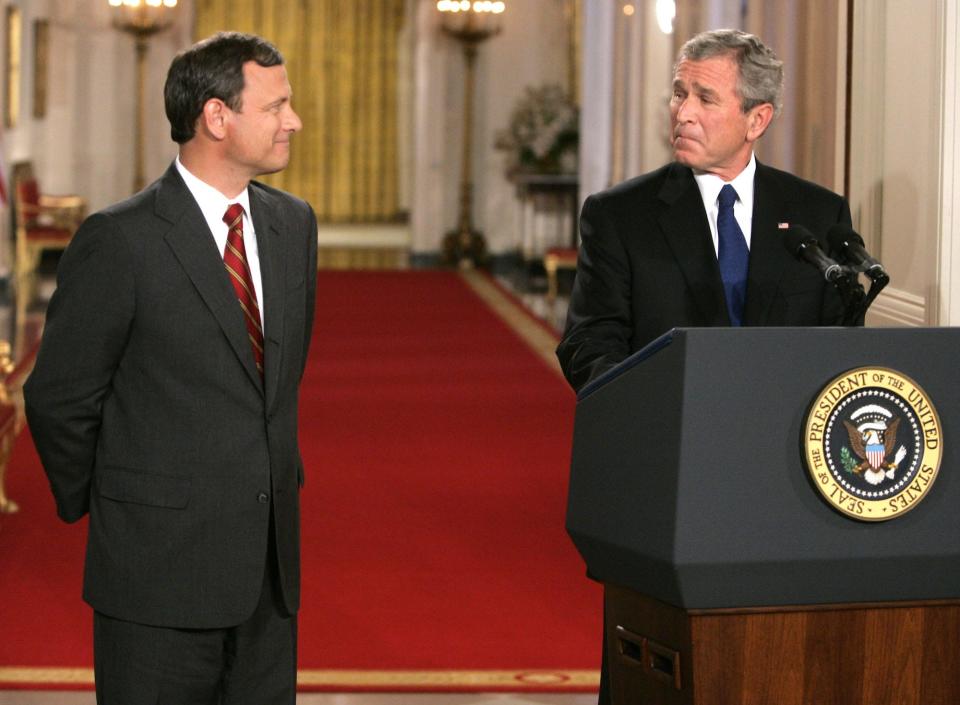 President Bush, right, looks towards his nominee for the Supreme Court, John G. Roberts Jr., as he introduces him at the White House Tuesday, July 19, 2005 in Washington.