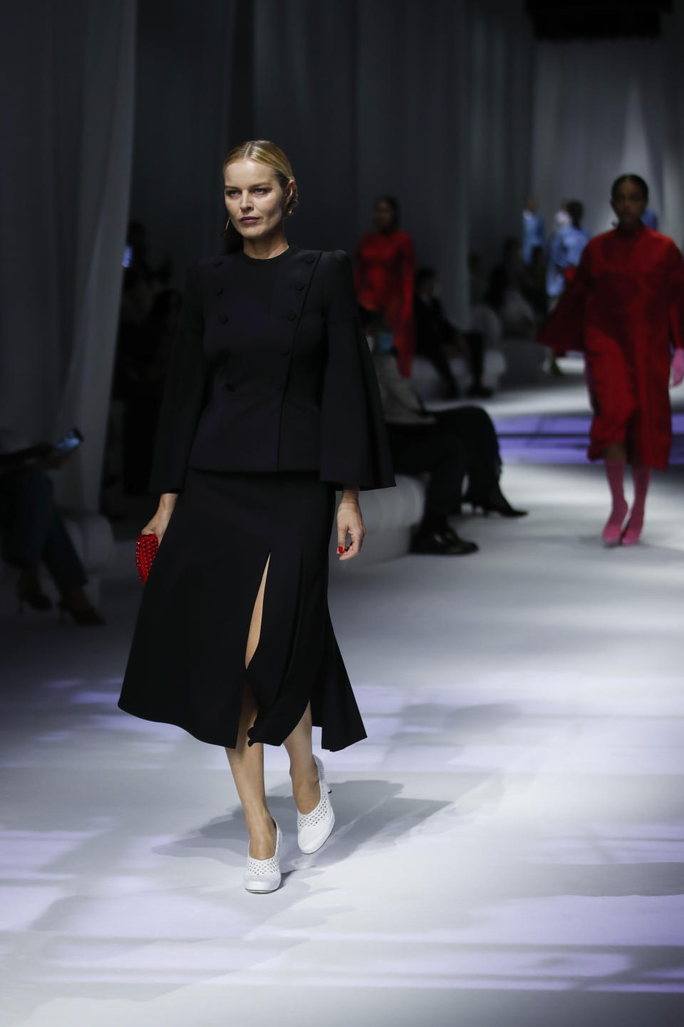 Model Eva Herzigova wears a creation as part of the Fendi 2021 women's spring-summer ready-to-wear collection during the Milan's fashion week in Milan, Italy, Wednesday, Sept. 23, 2020. (AP Photo/Antonio Calanni)