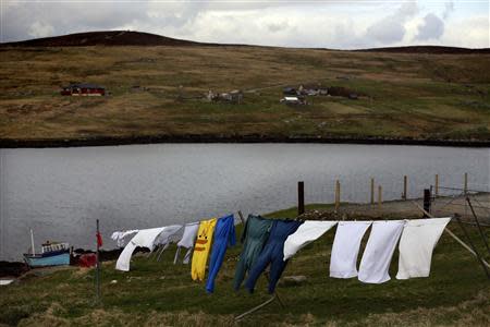 Laundry hangs on a clothes line on the mainland of the Shetland Islands April 4, 2014. REUTERS/Cathal McNaughton