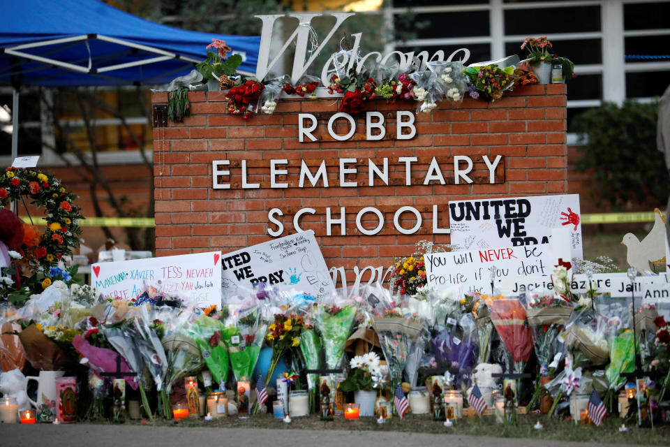 Flowers, candles and signs are left at a memorial for victims of the Robb Elementary School shooting, three days after a gunman killed nineteen children and two teachers, in Uvalde, Texas, May 27, 2022. / Credit: Reuters/Marco Bello