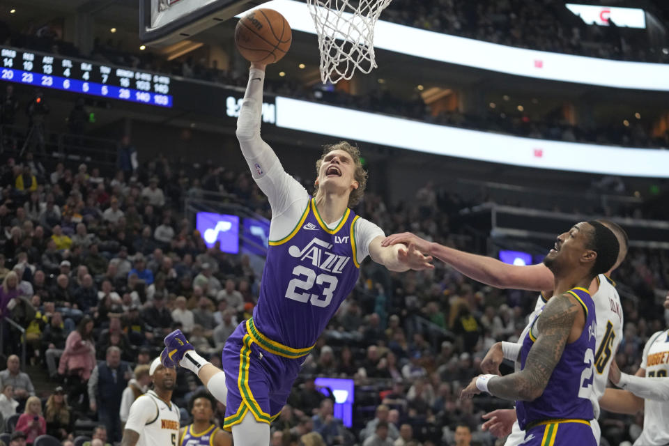 Utah Jazz forward Lauri Markkanen (23) is fouled as he drives to the basket during the second half of the team's NBA basketball game against the Denver Nuggets on Wednesday, Jan. 10, 2024, in Salt Lake City. (AP Photo/Rick Bowmer)