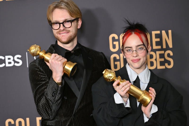 FINNEAS and Billie Eilish appear backstage after winning the award for the Best Original Song, Motion Picture award for "Barbie" -- "What Was I Made For?" during the Golden Globe Awards in Beverly Hills, Calif., on January 7. Photo by Chris Chew/UPI