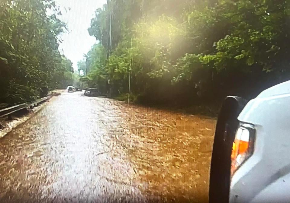 These photos taken from Upper Makefield police body cameras show the power of the five-feet wall of water that swept 11 cars off the road in the 1000 block of Washington Crossing Road on Saturday, July 15, 2023.