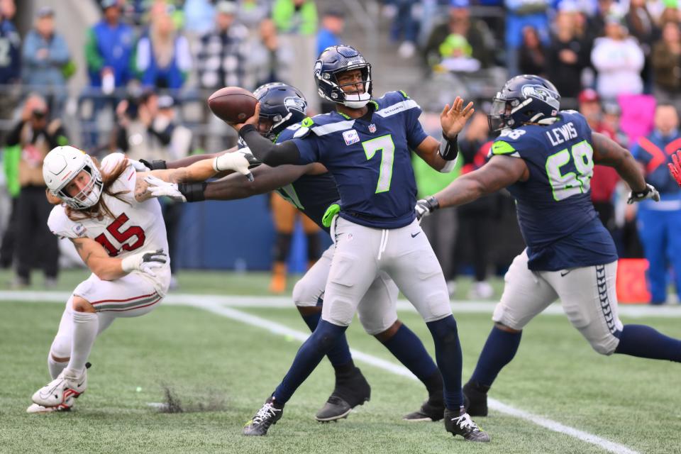 Oct 22, 2023; Seattle, Washington, USA; Seattle Seahawks quarterback Geno Smith (7) passes the ball against the Arizona Cardinals during the game at Lumen Field. Mandatory Credit: Steven Bisig-USA TODAY Sports
