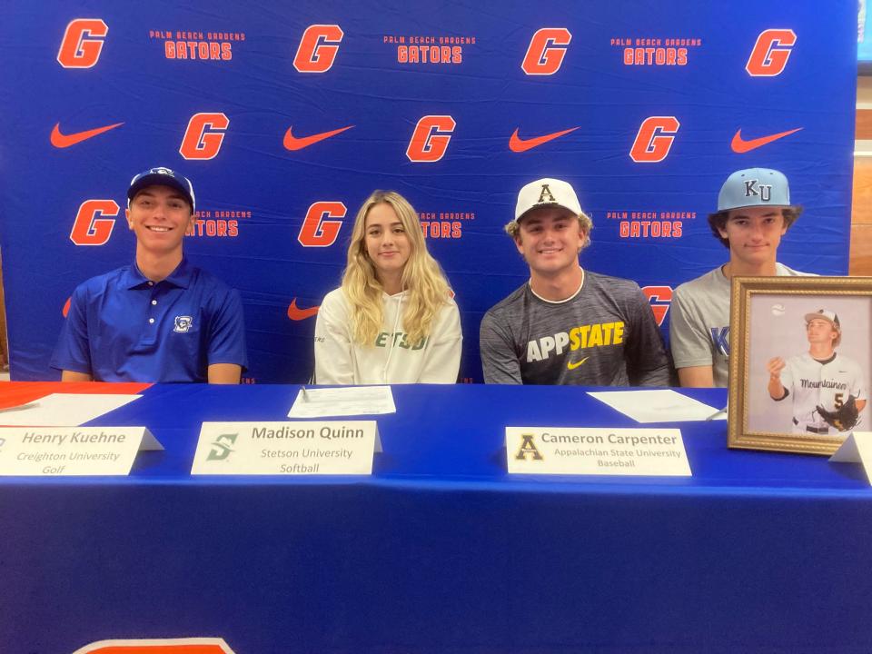 Henry Kuehne, Madison Quinn, Cam Carpenter and Gavin McSweeney (left to right) all put pen to paper during a signing ceremony at Palm Beach Gardens High on Wednesday, Nov. 8, 2023.