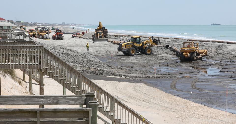 Heavy equipment operates along the southern area of North Topsail Beach in 2015 as part of a beach nourishment project.