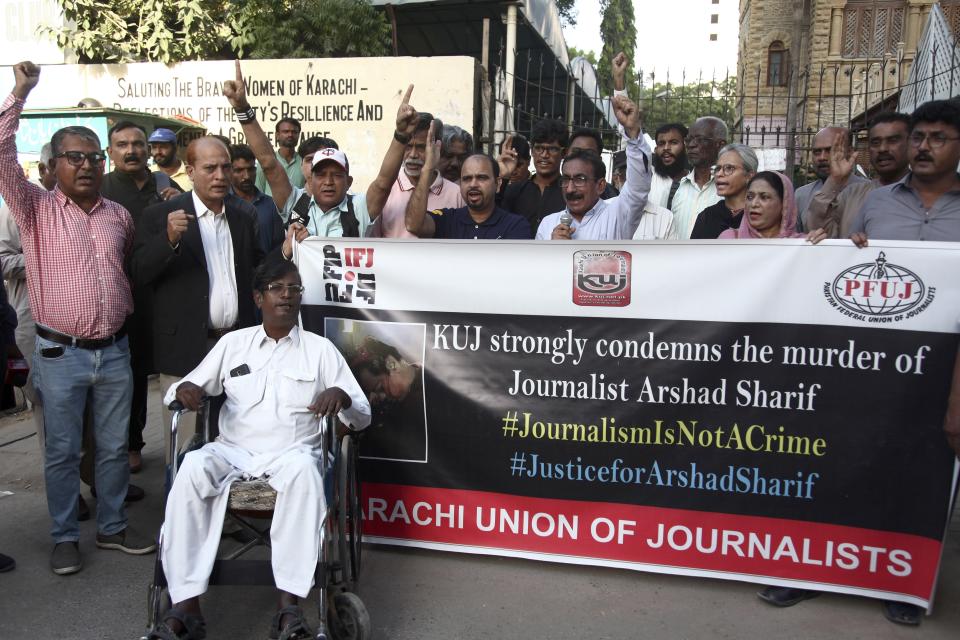 Journalists hold a demonstration to condemn the killing of senior Pakistani journalist Arshad Sharif by Kenyan police, in Karachi, Pakistan, Monday, Oct. 24, 2022. Sharif, 50, had been in hiding abroad after leaving Pakistan to avoid arrest on charges of criticizing his country's powerful military. Sharif was shot and killed by police after the car he was in sped up instead of halting at a roadblock near Nairobi, the police said. The police said it was a case of "mistaken identity" during a search for a similar car involved in a case of child abduction. (AP Photo/Ikram Suri)