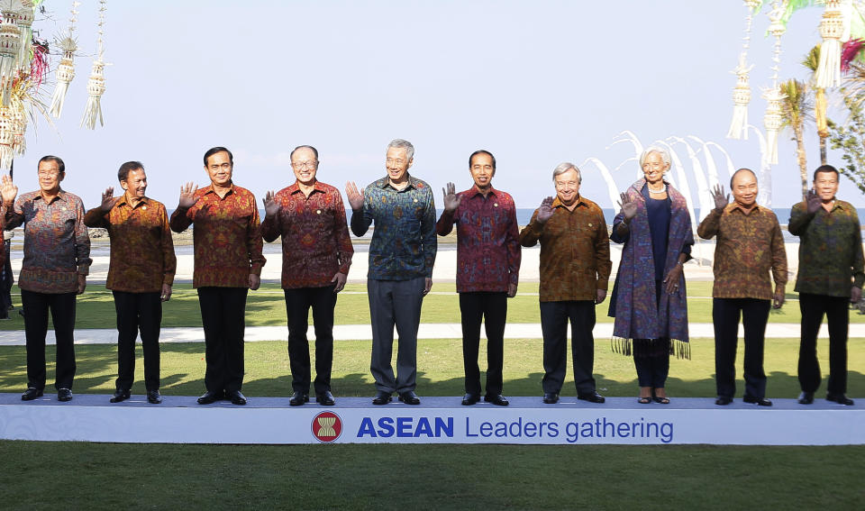 Southeast Asian leaders pose for family photo during ASEAN Leaders Gathering ont the sidelines of International Monetary Fund and World Bank Annual Meeting 2018 in Nusa Dua, Bali, Indonesia, Thursday, Oct. 11, 2018. From left, Cambodia's Prime Minister Hun Sen, Brunei Sultan Hassanal Bolkiah, Thailand's Prime Minister Prayuth Chan-ocha, World Bank President Jim Yong Kim, Singapore Prime Minister Lee Hsien Loong, Indonesia's President Joko Widodo, United Nations Secretary General Antonio Guterres, IMF Managing Director Christine Lagarde, Vietnam's Prime Minister Nguyen Xuan Phuc and Philippines President Rodrigo Duterte. (Johannes P. Christo/Pool Photo via AP)