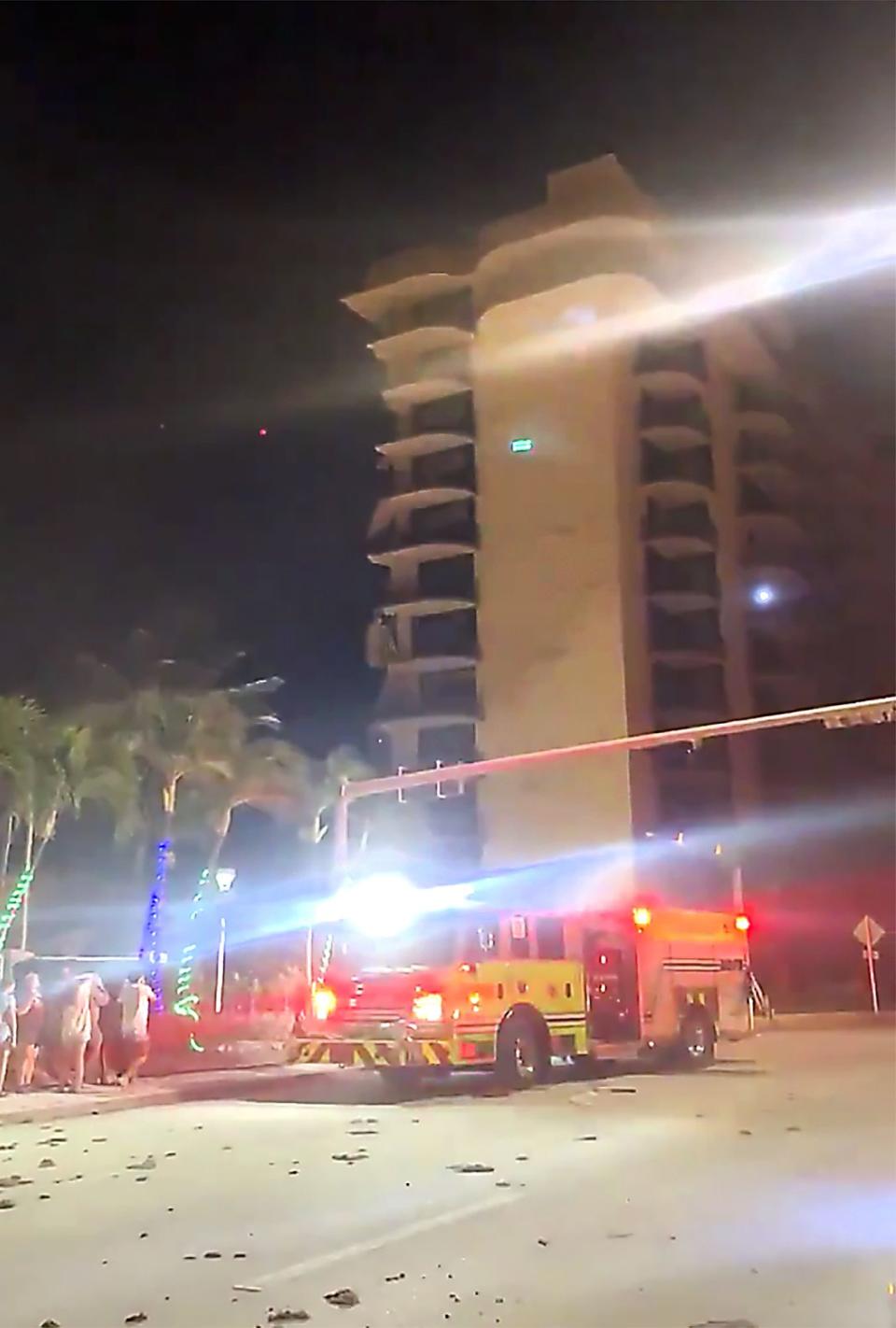 In this image made from video, fire rescue crews are on the scene of a building collapse in Surfside, Miami, Fla., early Thursday, June 24, 2021.