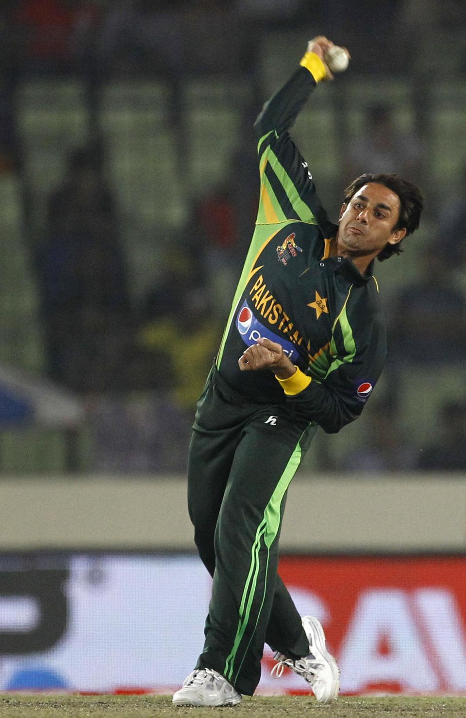 Pakistani cricket player Saeed Ajmal bowls during the Asia Cup final cricket match between Sri Lanka and Pakistan in Dhaka, Bangladesh, Saturday, March 8, 2014. (AP Photo/A.M. Ahad)