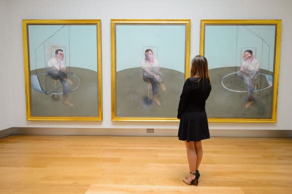 A visitor views the triptych 'Three Studies for a Portrait of John Edwards' by Francis Bacon, which is expected to fetch around 80 million US Dollars as part of Christie's Post-War and Contemporary Art sale in New York on May 12 and 13 2014. PRESS ASSOCIATION Photo. Picture date: Friday April 11, 2014. See PA story SALE Bacon. Photo credit should read: Dominic Lipinski/PA Wire