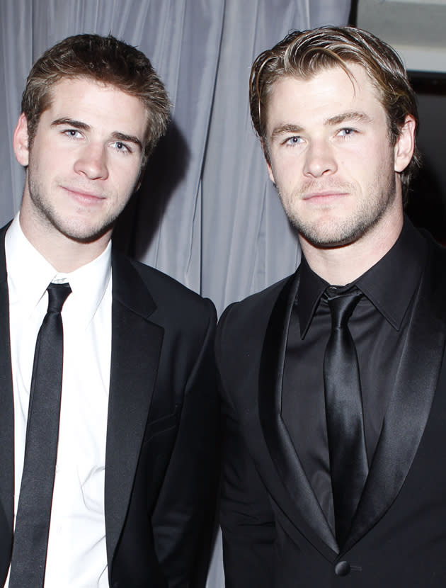 Chris Hemsworth and Liam Hemsworth photos: Looking dapper in their suits. Copyright [Getty]