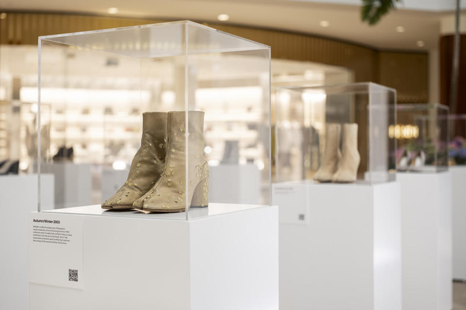 maroon cowboy boot with brown heel and white stiching