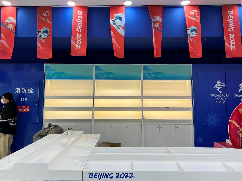 Empty shelves are seen during operating hours at a flagship merchandise store for the Beijing 2022 Winter Olympics, following a surge in demand for merchandise featuring the official mascot Bing Dwen Dwen, in Beijing, China February 8, 2022. Picture taken February 8, 2022.