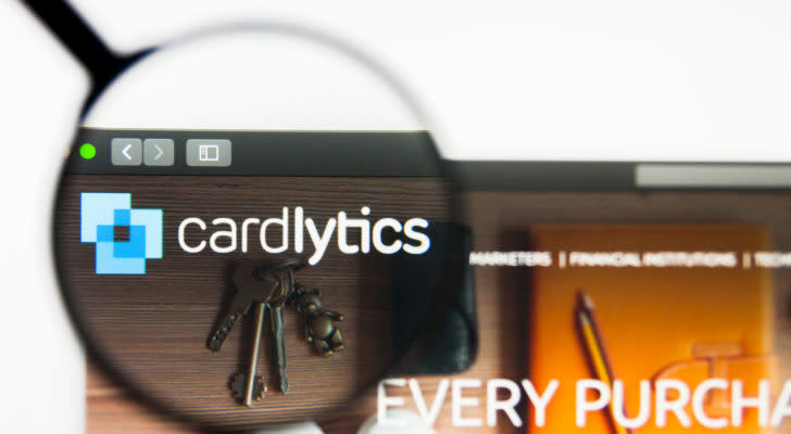 a magnifying glass zooms in on the Cardlytics logo on the company website