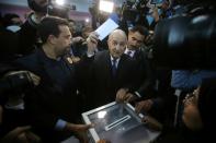 Algeria's presidential candidate Abdelmajid Tebboune casts his ballot during the presidential election in Algiers