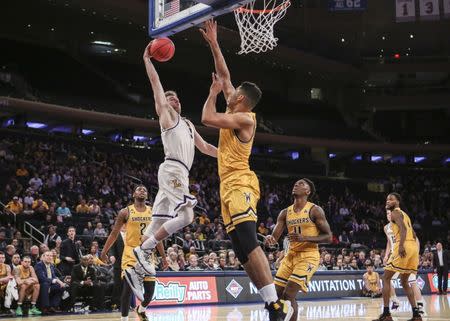 Apr 2, 2019; New York, NY, USA; Lipscomb Bisons guard Michael Buckland (3) drives to the basket against the Wichita State Shockers in the first half of the NIT semifinals at Madison Square Garden. Mandatory Credit: Wendell Cruz-USA TODAY Sports