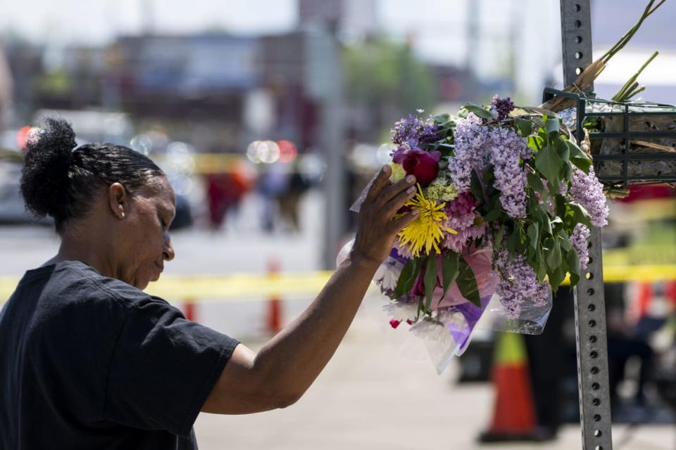 <div class="inline-image__caption"><p>Jeanne LeGall of Buffalo pays her respects at a makeshift memorial at Tops Friendly Market on Sunday.</p></div> <div class="inline-image__credit">Kent Nishimura/Los Angeles Times via Getty</div>