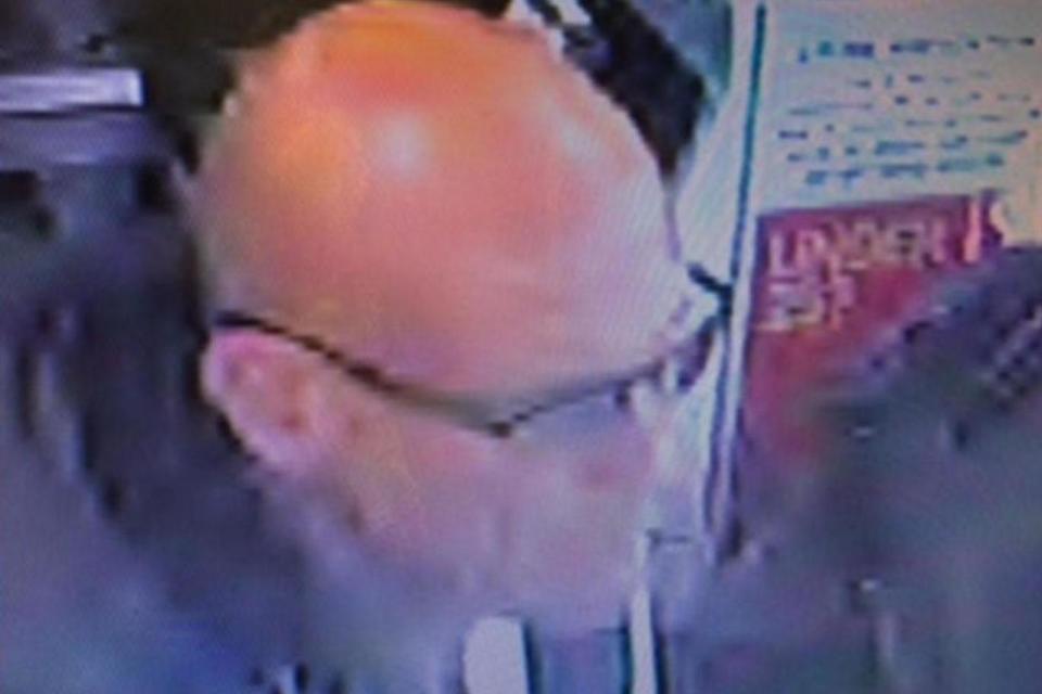 Richman caught on CCTV buying a phone top-up card.