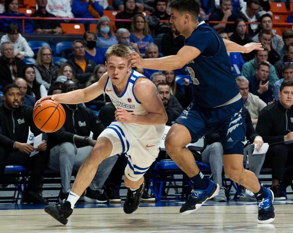 Boise State guard Jace Whiting gets the jump on Nevada guard Jarod Lucas on a scoring drive in the first half Jan. 17 at ExtraMile Arena in Boise.