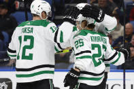 Dallas Stars left wing Joel Kiviranta (25) celebrates his goal against the Buffalo Sabres with center Radek Faksa (12) and another teammate during the second period of an NHL hockey game Thursday, March 9, 2023, in Buffalo, N.Y. (AP Photo/Jeffrey T. Barnes)