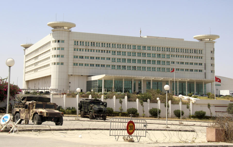 Tunisia's state television is surrounded by troops in Tunis, Tunisia, Monday, July 26, 2021. Troops surrounded Tunisia's parliament and blocked its speaker from entering Monday after the president suspended the legislature and fired the prime minister following nationwide protests over the country's economic troubles and the government's handling of the coronavirus crisis. (AP Photo/Hedi Azouz)