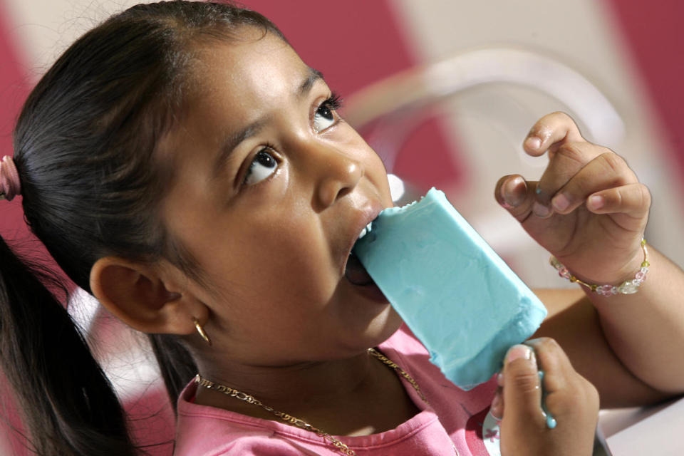 Image: Arely Flores, 4, eats a bubble gum flavored paleta in Garden Grove, Calif., in 2007. (Irfan Khan / Los Angeles Times via Getty Images file)