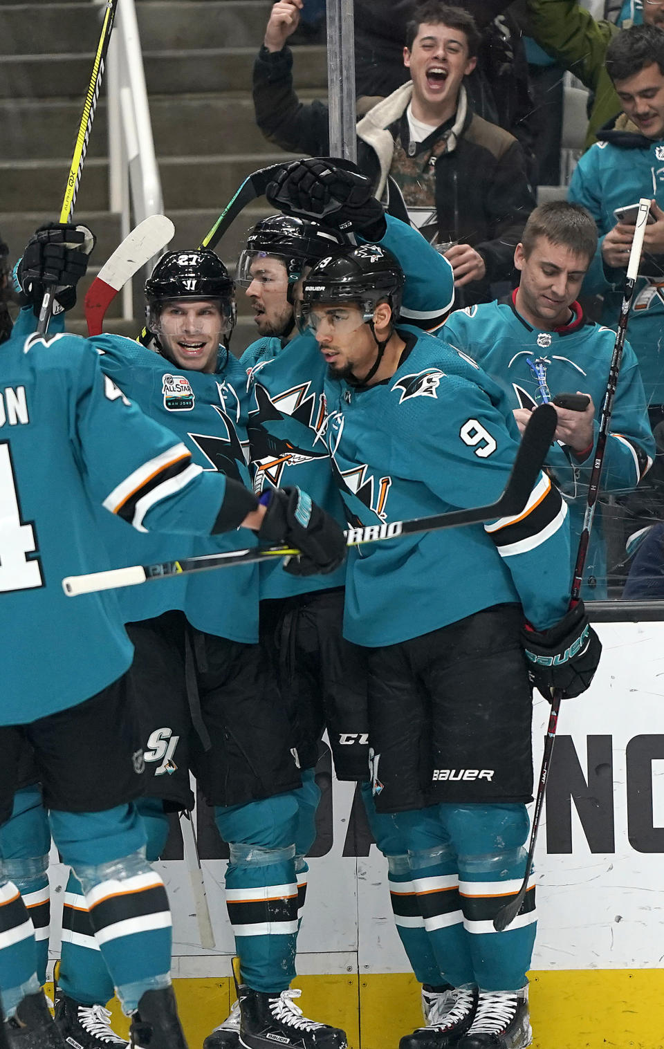 San Jose Sharks center Tomas Hertl, center, celebrates with Joonas Donskoi (27) and Evander Kane (9) after scoring a goal against the Pittsburgh Penguins during the first period of an NHL hockey game in San Jose, Calif., Tuesday, Jan. 15, 2019. (AP Photo/Tony Avelar)