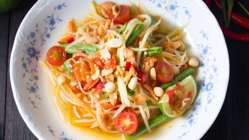 A green papaya salad with a fiery kick. - pattarasiri virayasi/Adobe Stock