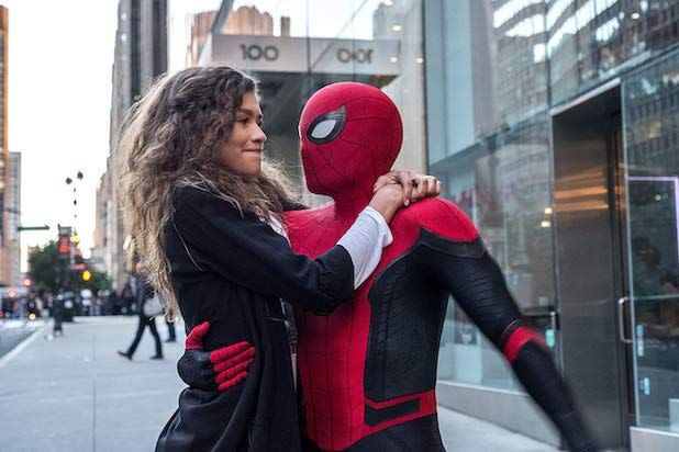 spider man holds mj in a scene from spider man far from home the 23rd movie if you want to watch all the marvel movies in order