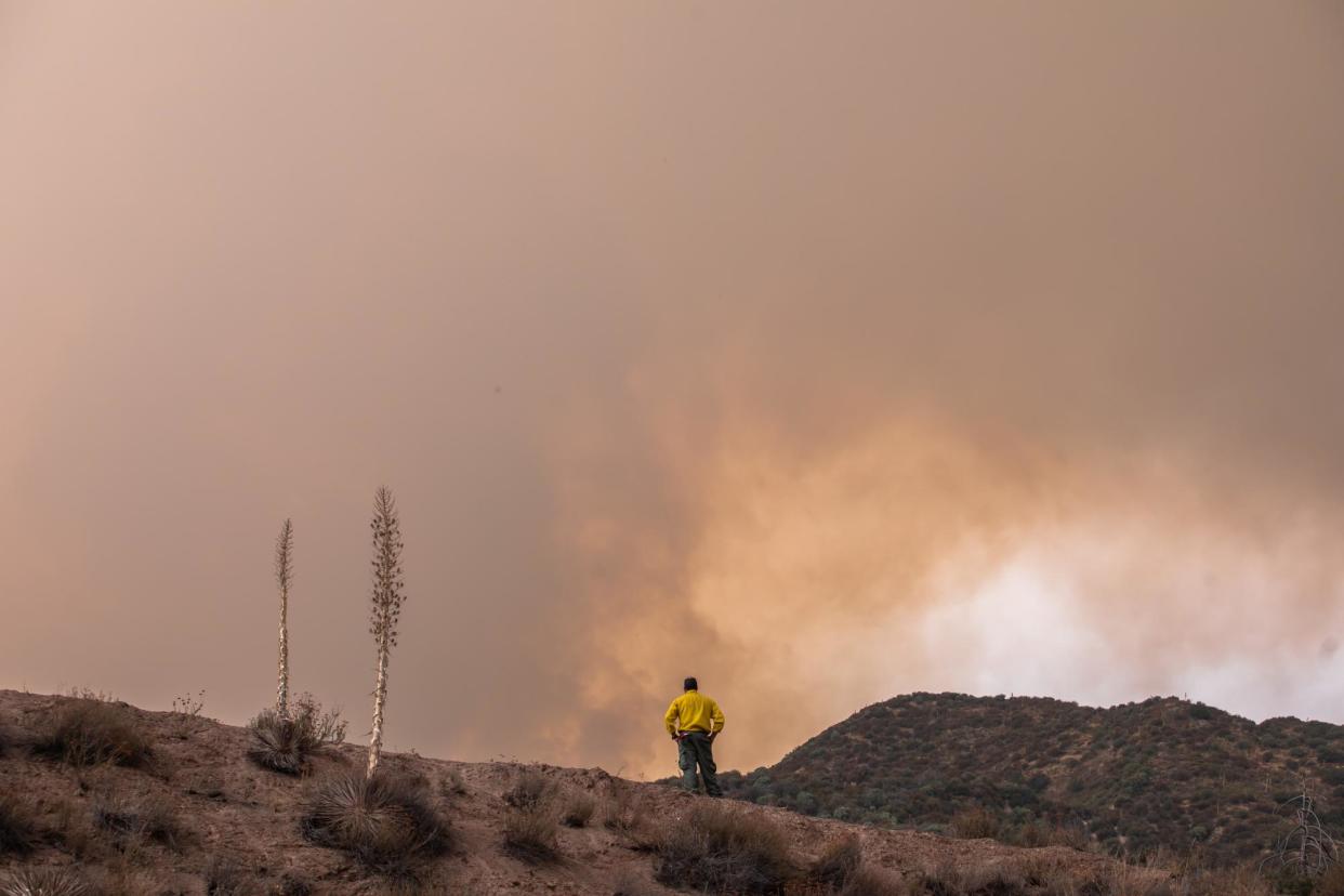 <span>A firefighter at the Line fire in the foothills of the San Bernardino national forest, in Mentone, California, on 9 September 2024.</span><span>Photograph: Apu Gomes/EPA</span>