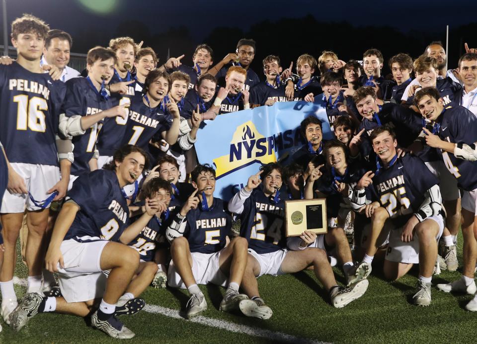 Pelham players celebrate their 14-6 victory over Pearl River  in the boys lacrosse Section 1 Class B championship game at Lakeland High School in Shrub Oak May 26, 2022. 