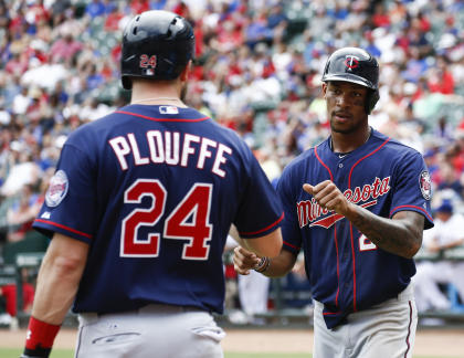 Byron Buxton (right) scored the winning run in his debut. (AP)