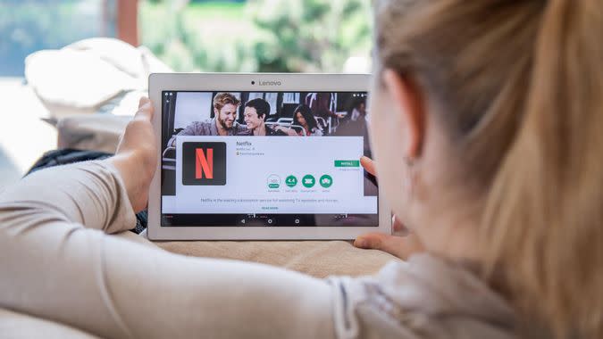 woman watching Netflix on her couch