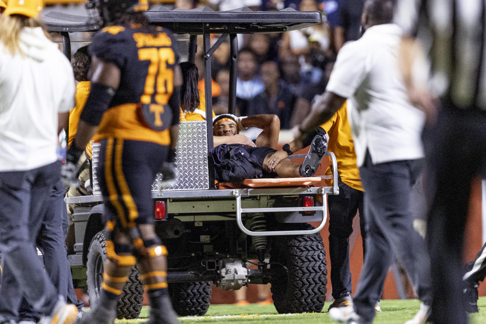 Tennessee wide receiver Bru McCoy (15) is taken from the field after being injured during the first half of the team's NCAA college football game against South Carolina on Saturday, Sept. 30, 2023, in Knoxville, Tenn. (AP Photo/Wade Payne)