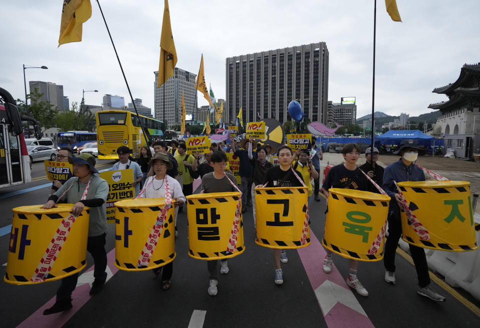 Protesters march toward the Japanese Embassy during a rally against the Japanese government's decision to release treated radioactive water from the damaged Fukushima nuclear power plant, in Seoul, South Korea, Saturday, July 8, 2023. (AP Photo/Ahn Young-joon)